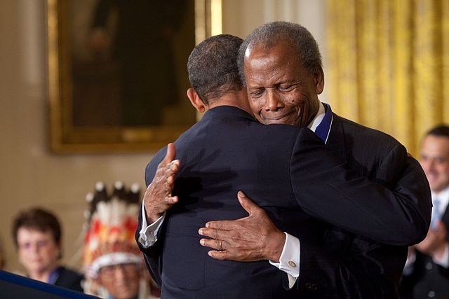 President+Barack+Obama+hugs+Presidential+Medal+of+Freedom+recipient+actor+Sidney+Poitier+during+the+award+ceremony+in+the+East+Room+of+the+White+House%2C+on+Aug.+12%2C+2009.%0A%0APublic+Domain%0A