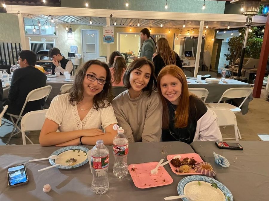 Freshman Sarrah Wilkes, sophomore Rebekah Sheff, and freshman Sydney Kolker enjoy Cafe Chabad on Wednesday night.