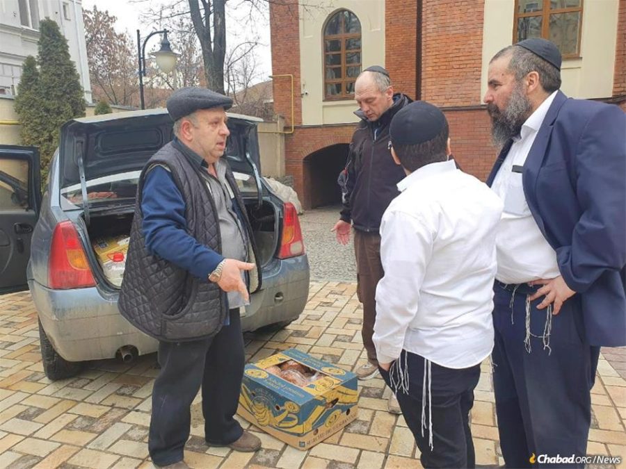 A brave Kharkov Jewish community member arrives with a delivery of food at the Chabad-Lubavitch Choral Synagogue in Kharkov, Ukraine, on Feb. 28, 2022.