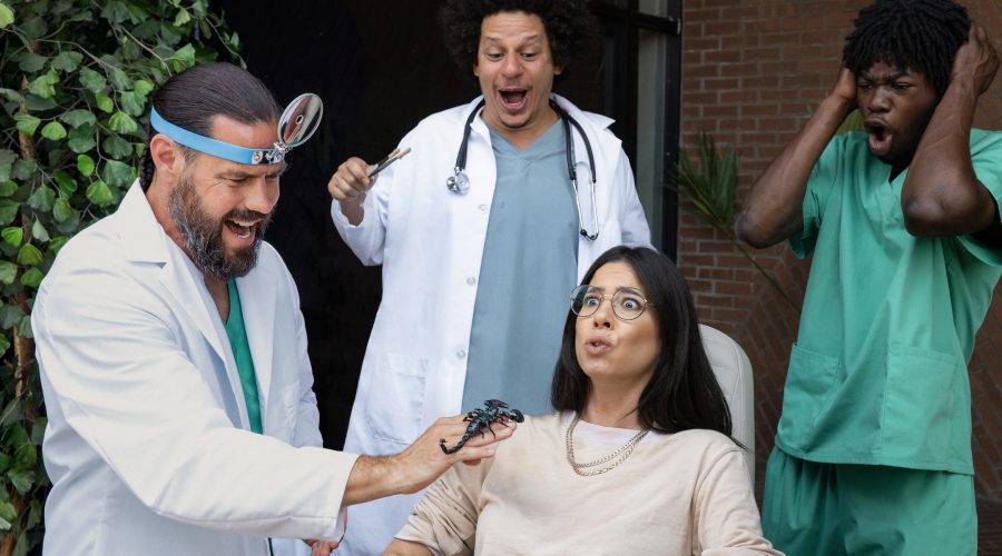 Rachel Wolfson in an uncomfortable scene with, from left, Chris Pontius, Eric Andre, and Eric Manaka — and a scorpion — in "Jackass: Forever." (Paramount Pictures)