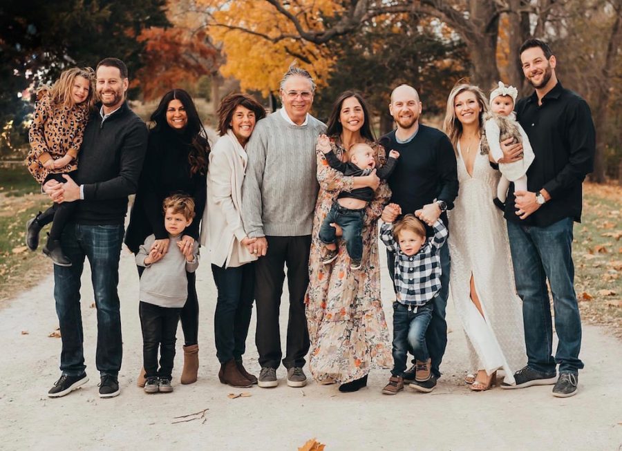 Mike and Jane Weinhaus are flanked by their extended family. The couple, along with their two adult sons and one of their son’s wives, were among the first St. Louisans to contract the virus in March 2020. Both Michael and Jane were hospitalized; she spent nine days on a ventilator.