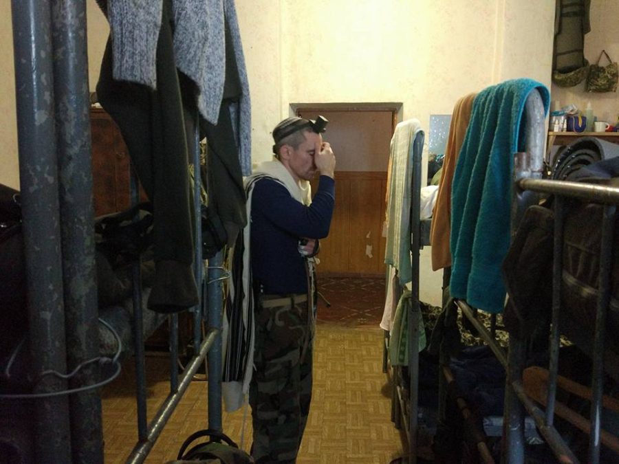 Tzvi Arieli, seen here praying in a Ukrainian army barracks in 2017, is a Ukrainian immigrant from Israel who is fighting in its army. (Courtesy Arieli)