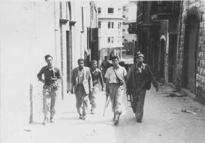 APRIL 22: Jewish fighters patrol during the battle for Haifa in April 1948.
