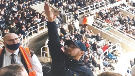 A British soccer fan said his Nazi salute was a wave hello. Authorities weren’t buying it.