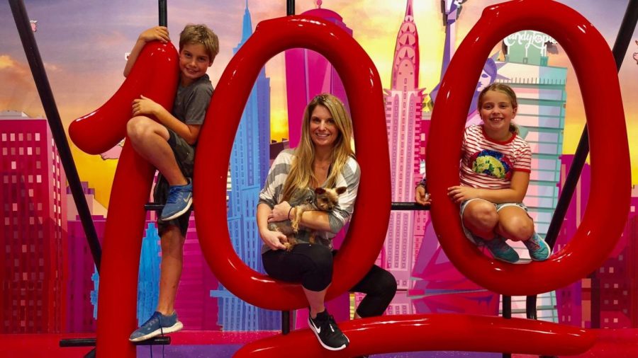 Lindsey Marglous center  with her nephew Sawyer Merlin left and niece Lila Merlin hamming it up at Candytopia a candy themed pop up in New York City in 2018    