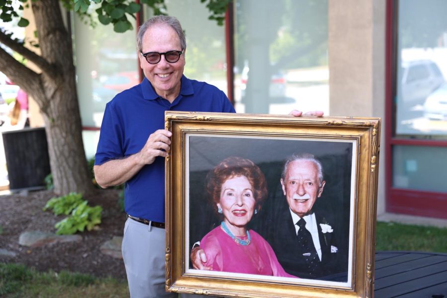 Great-nephew Randy Green holds a photograph of Henry and Gladys Crown. Photo: Bill Motchan