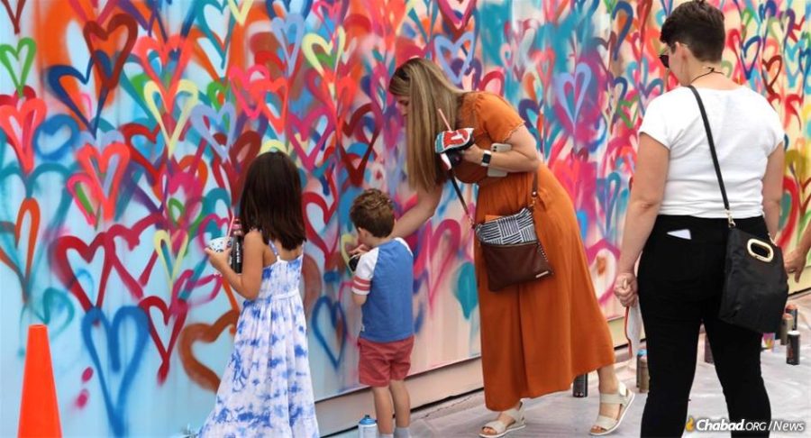 At the St. Charles Jewish Festival this August, visitors were greeted by an oversized shipping container and artist Zack Smithey. Together, the community helped paint the container and decorate it with hundreds of hearts and Jewish-themed imagery, like Shabbat candles. It would become the new sukkah of the Chabad Jewish Center of St. Charles County, Mo.