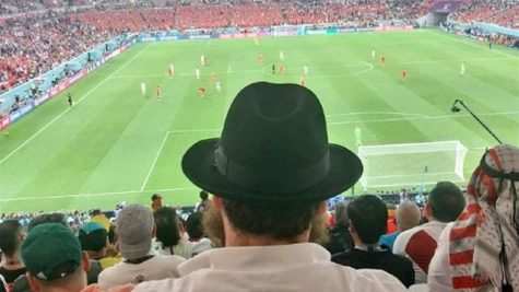 Rabbi Eliyahu Chitrik, 21, takes in one of the opening-week matches at the World Cup in Qatar. He spends most of his time at the games providing kosher food to Jewish visitors.

