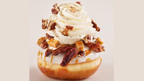 Roladin is the most famous purveyor of outlandish Hanukkah donuts in Israel. This one is full of pastry cream and topped with caramelized pecans, toffee and whipped cream. Photo by Ronen Mangan