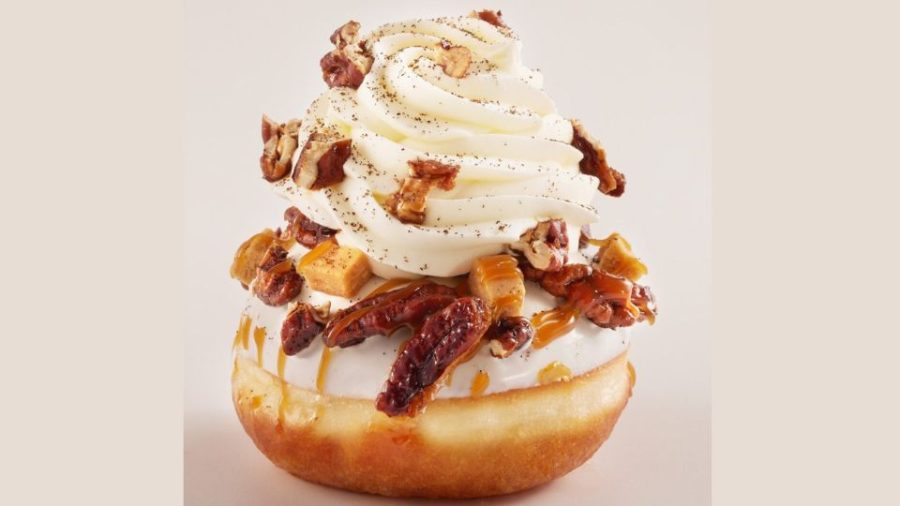 Roladin is the most famous purveyor of outlandish Hanukkah donuts in Israel. This one is full of pastry cream and topped with caramelized pecans, toffee and whipped cream. Photo by Ronen Mangan