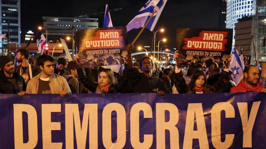 Israelis march during a rally against government plans to give lawmakers more control of the judicial system, Tel Aviv, Feb. 4, 2023. (Jack Guez/AFP via Getty Images)