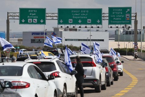 Israelis protesting against the governments controversial judicial reform bill block the main road leading to the departures area of Ben Gurion Airport near Tel Aviv on March 9, 2023. (Ahmad Gharabli/AFP via Getty Images)