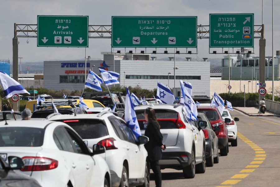Israelis+protesting+against+the+governments+controversial+judicial+reform+bill+block+the+main+road+leading+to+the+departures+area+of+Ben+Gurion+Airport+near+Tel+Aviv+on+March+9%2C+2023.+%28Ahmad+Gharabli%2FAFP+via+Getty+Images%29