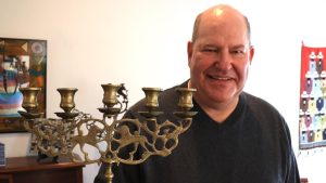 St. Louisan Marc Lapp (below) collects vintage Judaica. His collection includes carved wooden lion (from the mid-1900s) and the silver Torah finials 