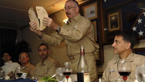 Herman “Herm” Shelanski (far right), then skipper of the squadron on the USS John C. Stennis, celebrating Passover in 2008 on the ship with chaplain Rabbi Irving Elson (holding matzah) and Executive Officer Captain Ron Reis (next to the left). Credit: Courtesy of Vice Adm. (Ret.) Herman Shelanski.