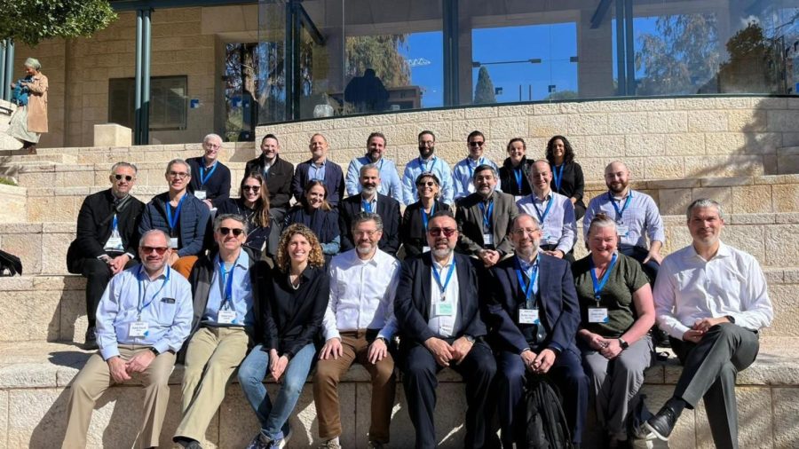Participants on a rabbis trip to Israel organized by UJA-Federation of New York pause on the steps of the Shalom Hartman Institute in Jerusalem, March 17, 2023. (Courtesy of UJA-Federation)