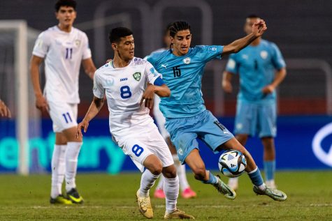 Bekhruzbek Askarov, left, of Uzbekistan battles for the ball with Tay Abed of Israel during the FIFA U-20 World Cup, May 30, 2023 in Mendoza, Argentina.