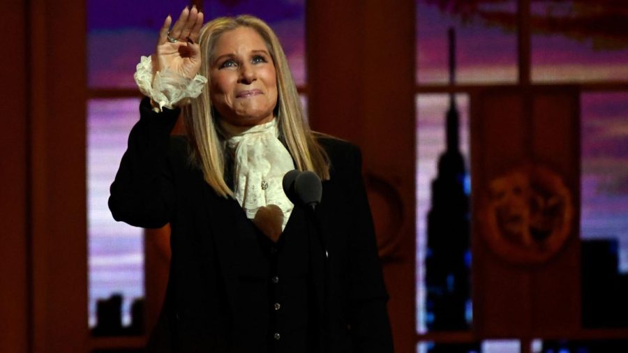 Barbara Streisand waving.