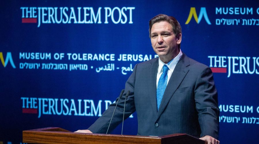 Florida Gov. Ron DeSantis listens to other speakers before signing a series of education bills at Cambridge Christian school in Tampa, Florida, May 17, 2023.