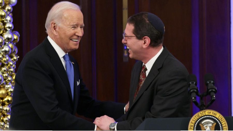 President+Joe+Biden+shakes+hands+with+Rabbi+Charlie+Cytron-Walker+during+a+Hanukkah+holiday+reception+in+the+Grand+Foyer+of+the+White+House%2C+Dec.+19%2C+2022.+%28Alex+Wong%2FGetty+Images%29