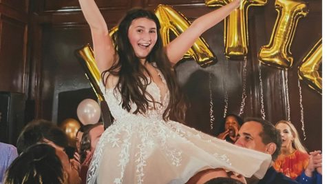 Katie Shore being hoisted in the air during The Hor at her Bat Mitzvah.