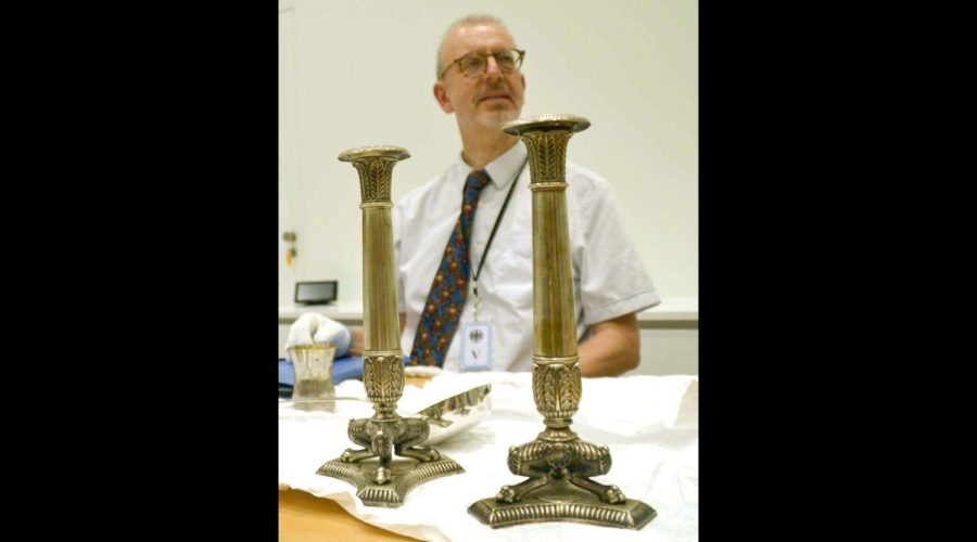 Matthias Weniger, head of provenance research at the Bavarian National Museum, shown with museum objects in Tel Aviv, June 5, 2023.