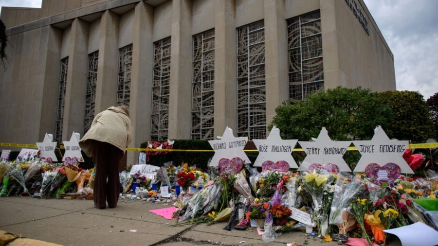 Mourners visit the memorial outside the Tree of Life Synagogue, Oct. 31, 2018 in Pittsburgh, Pennsylvania, four days after 11 Jewish worshippers were killed during services there. The alleged shooters trial begins April 24, 2023. (Jeff Swensen/Getty Images)