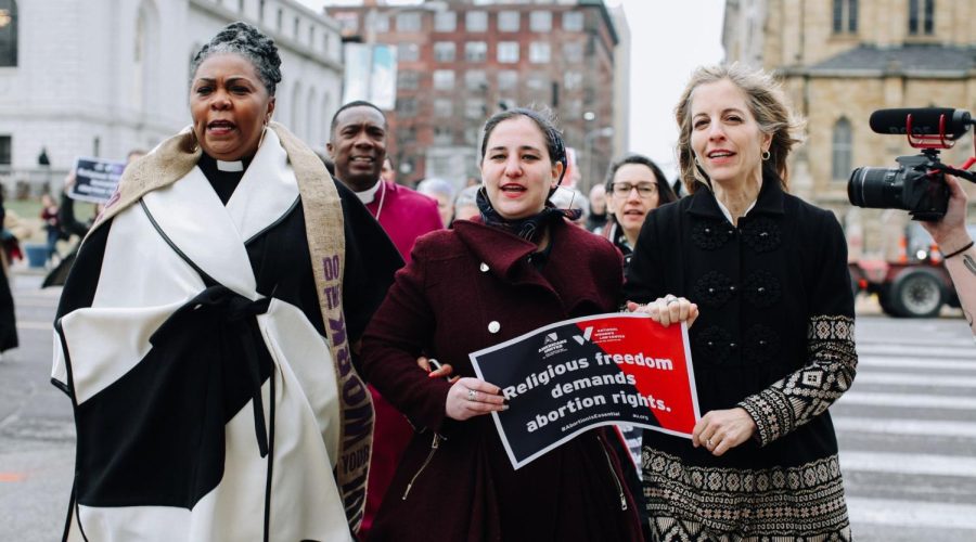 From left to right: Rev. Traci Blackmon, Maharat Rori Picker Neiss and Americans United for Separation of Church & State CEO Rachel Laser march to the Civil Courts building in St. Louis. (Courtesy of Americans United for Separation of Church & State)