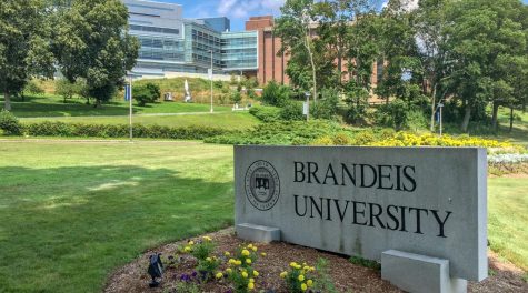 A sign on the Brandeis University campus with the schools emblem and motto reads, Truth even unto its innermost parts. (Wikimedia)