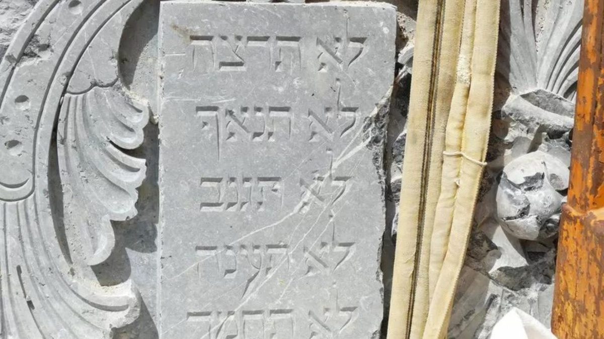 A stone tablet with some of the Ten Commandments is seen after constructions workers in Munich uncover rubble from the synagogue that was destroyed by the Nazis, July 2023 (Courtesy Jewish Museum Munich)