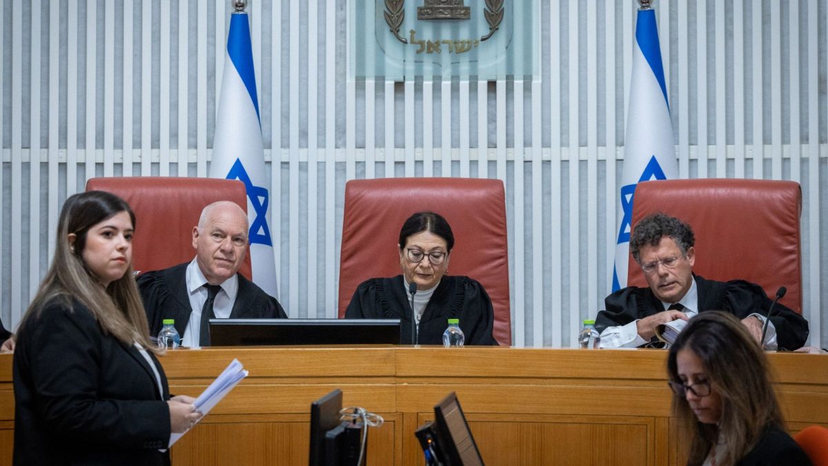 President of the Israeli Supreme Court Esther Hayut and fellow justices arrive for a court hearing on petitions demanding the annulment of the appointment of Shas leader Aryeh Deri as a government minister, at the Supreme Court in Jerusalem, Jan. 5, 2023. 