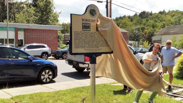 Photographer Isaac Jeffreys, who runs visuals and social media for the Borscht Belt Markers Project, unveils the Mountain Dale marker. 