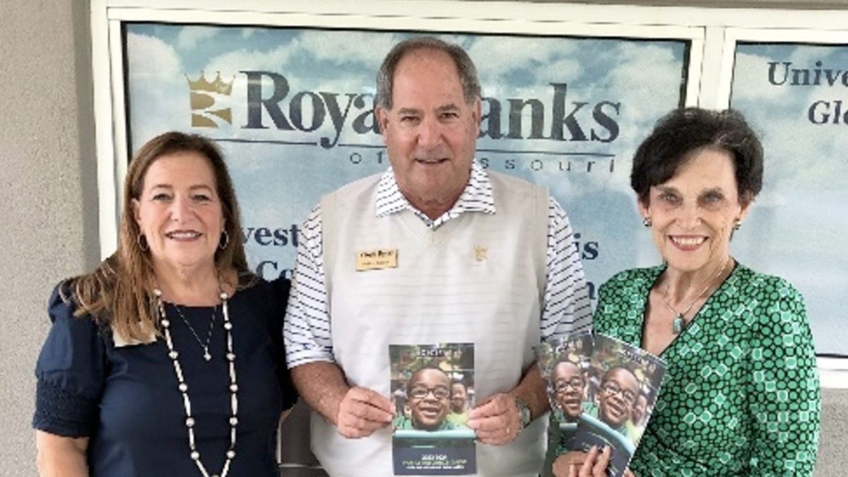 NCJWSTL CEO Ellen Alper (left) and Board President Nancy Litz flank Royal Banks of Missouri President and CEO Mitchell P. Baden. NCJWSTL and Royal Banks of Missouri partnered on the publication of a Family Resource Guide. 