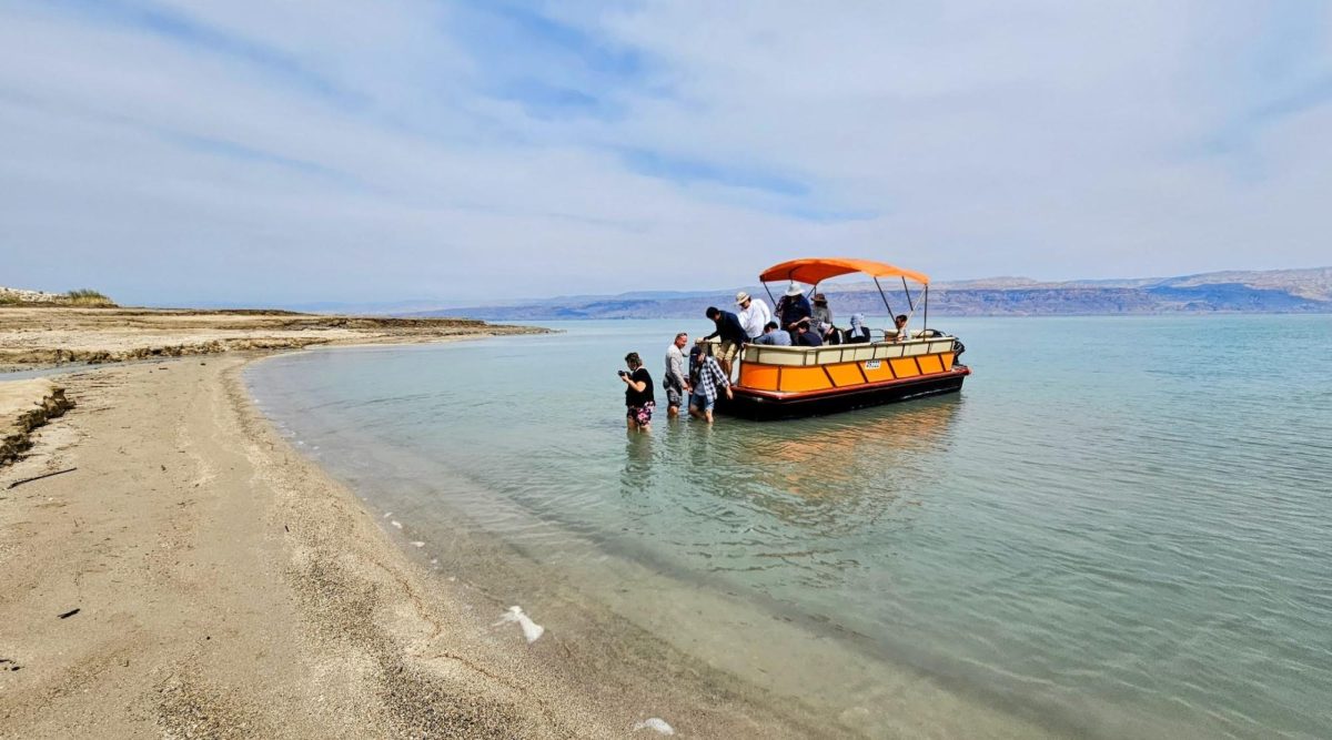 Passengers wade into the waters of the Dead Sea from Noam Bedeins boat on a recent excursion. 