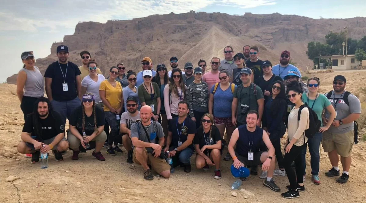 Participants of a 2018 Birthright trip for adults ages 27-32 visit the Masada fortress in Israel. (