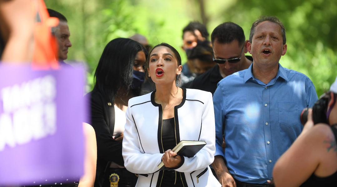 New York City Council member Brad Lander, right, earned the endorsement of Rep. Alexandria Ocasio-Cortez, center, in his race for New York City comptroller. 

