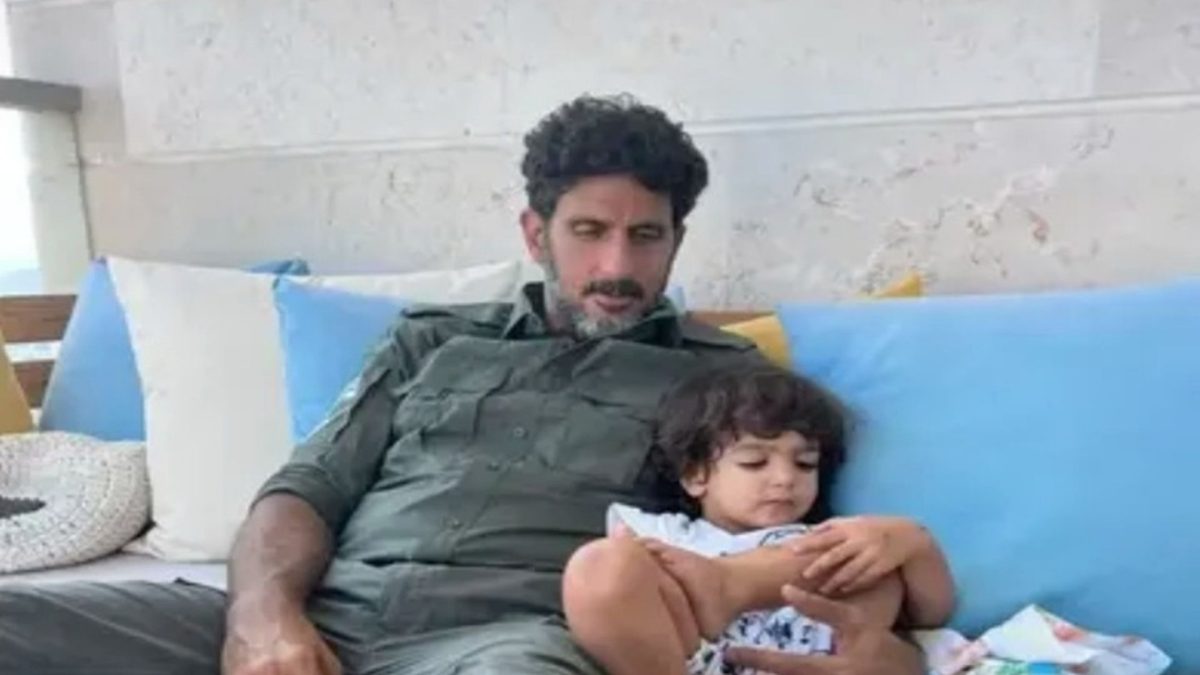 Fauda star Tsahi Halevi with his son wearing an Israeli army uniform. 