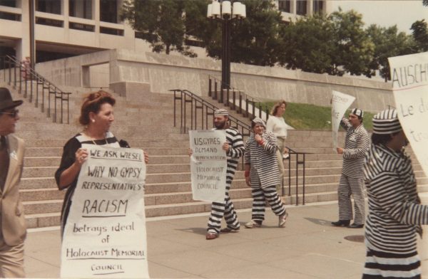 From “Rain of Ash: Roma, Jews, and the Holocaust.: Romani activist demonstrate in front of a USHMC meeting in Washington D.C. in 1984.