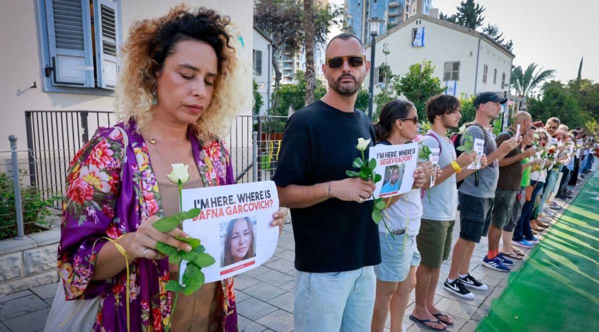 People call for the release of Israelis held hostage by Hamas militants in Gaza, outside the Ministry of Defense in Tel Aviv, Oct. 17, 2023. 