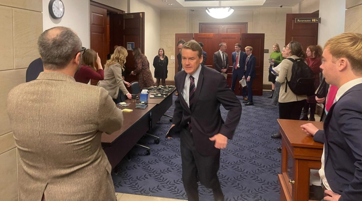 Sen. Michael Bennet, a Colorado Democrat, runs out of a Senate room where there was a screening of the Oct. 7 Hamas atrocities, in the U.S. Capitol, Nov. 28, 2023. 