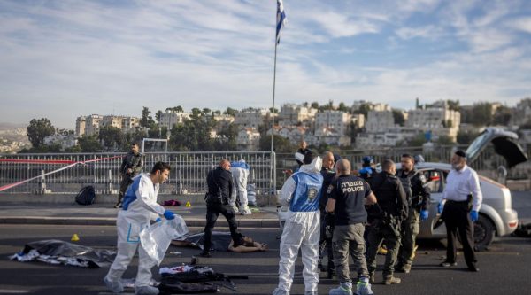 Israeli security at the scene of a terror shooting attack at the entrance to Jerusalem, Nov 30, 2023.