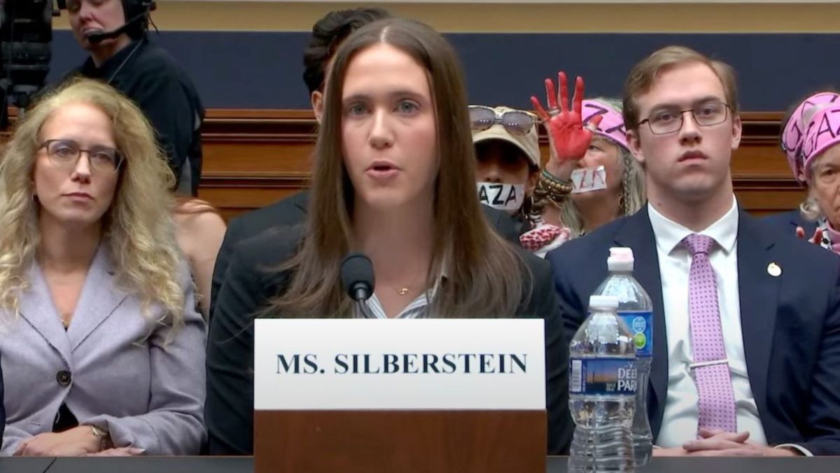 Amanda Silberstein, a Jewish Cornell University student, testifies before the U.S. House on the antisemitism she has experienced on campus as pro-Palestinian protesters demonstrate behind her, Washington, D.C., Nov. 8, 2023. (Screenshot via YouTube)