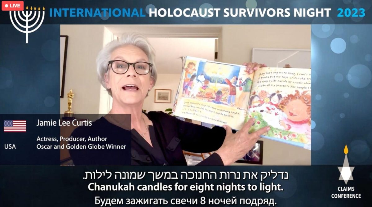 Actor Jamie Lee Curtis reads a page from her childrens book during remarks at the Claims Conferences virtual event, Dec. 11, 2023. (Screenshot)