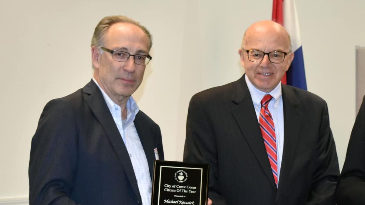 Michael Karasick (left) receives the Citizen of the Year award from Creve Coeur Mayor Dr. Robert Hoffman.