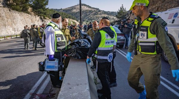 Israeli security and rescue forces at the scene of a terror shooting attack near Maaleh Adumim, in the West Bank, Feb. 22, 2024. (Chaim Goldberg/Flash90)
