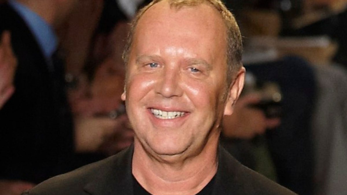 Michael Kors receives applause at the conclusion of his Fall/Winter 2010 show at New York Fashion Week, February 2010.