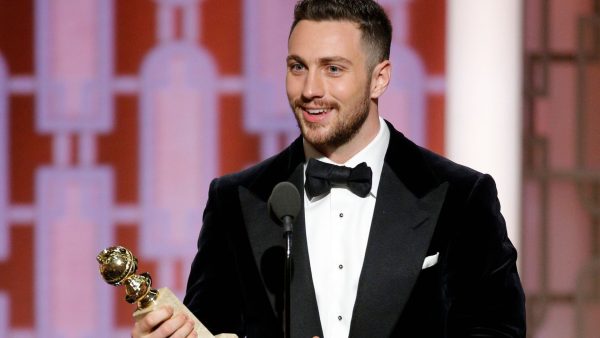  Aaron Taylor-Johnson accepts his award for best supporting actor during the 74th Golden Globe Awards at Beverly Hilton. 