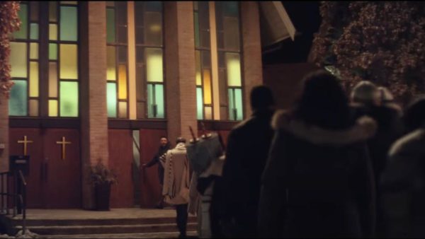 The Neighbors ad depicts a church welcoming in a nearby synagogue after a bar mitzvah service was interrupted by a bomb threat. (Screenshot from YouTube)