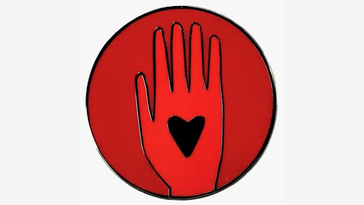 Each+Artists4Ceasefire+pin+resembles+a+glossy+red+quarter%2C+with+an+image+of+a+hand+surrounding+a+small+black+heart.%0ACredit...Artists4Ceasefire