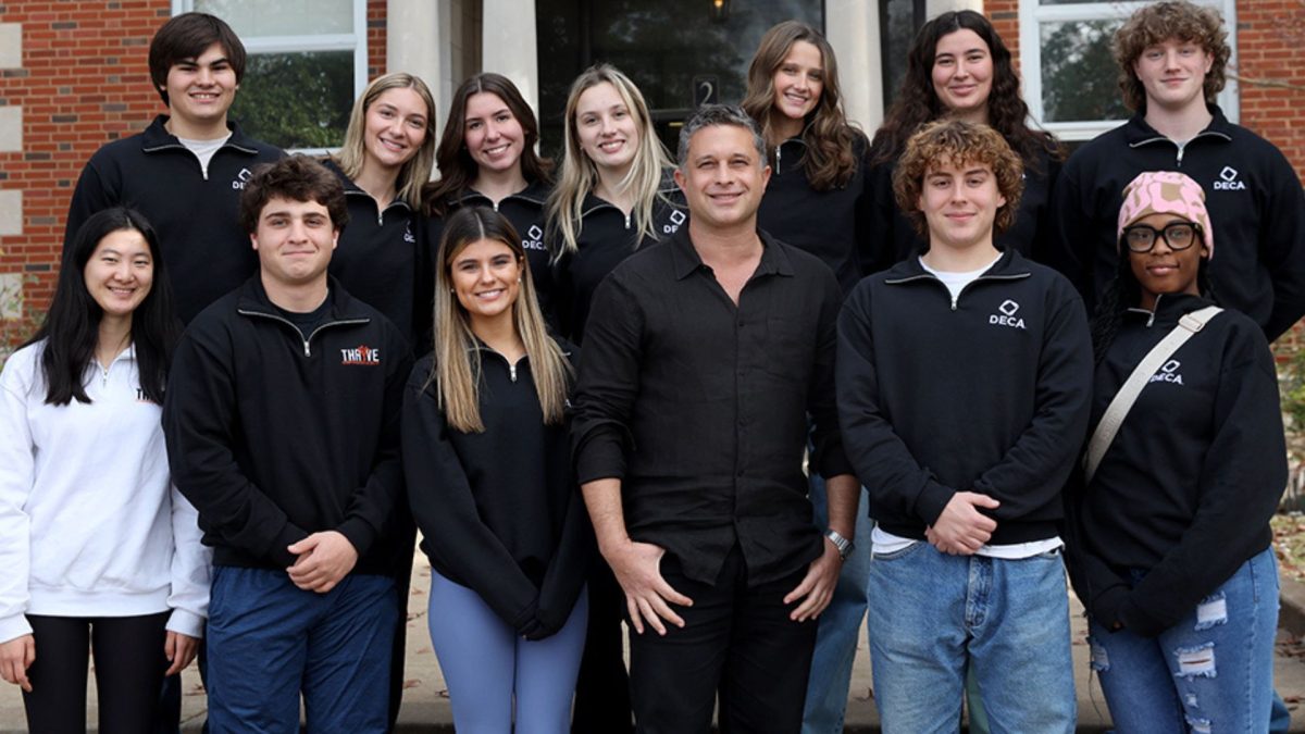 Brian Feit, co-founder of the social marketing agency BMF, pictured with Thrive students in front of Webster Groves High School. 


